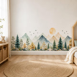 Wide watercolor-style landscape with sage and blue-gray mountains, evergreen trees, rocks, a golden sun and small birds.