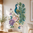 Teal peacock wall decal with gold-colored feather details, curling vines, pink and lavender flowers and a butterfly.