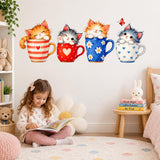 Four watercolor kitten teacup decals above a girl reading on the floor in a pastel bedroom with toys and a bunny lamp.