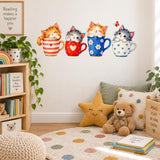 Cute watercolor kittens in four colorful teacups on a playroom wall above a reading corner with books and teddy bear.