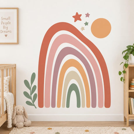 Boho rainbow wall decal with muted earth tone arches, an orange sun, five stars and a green leafy sprig.