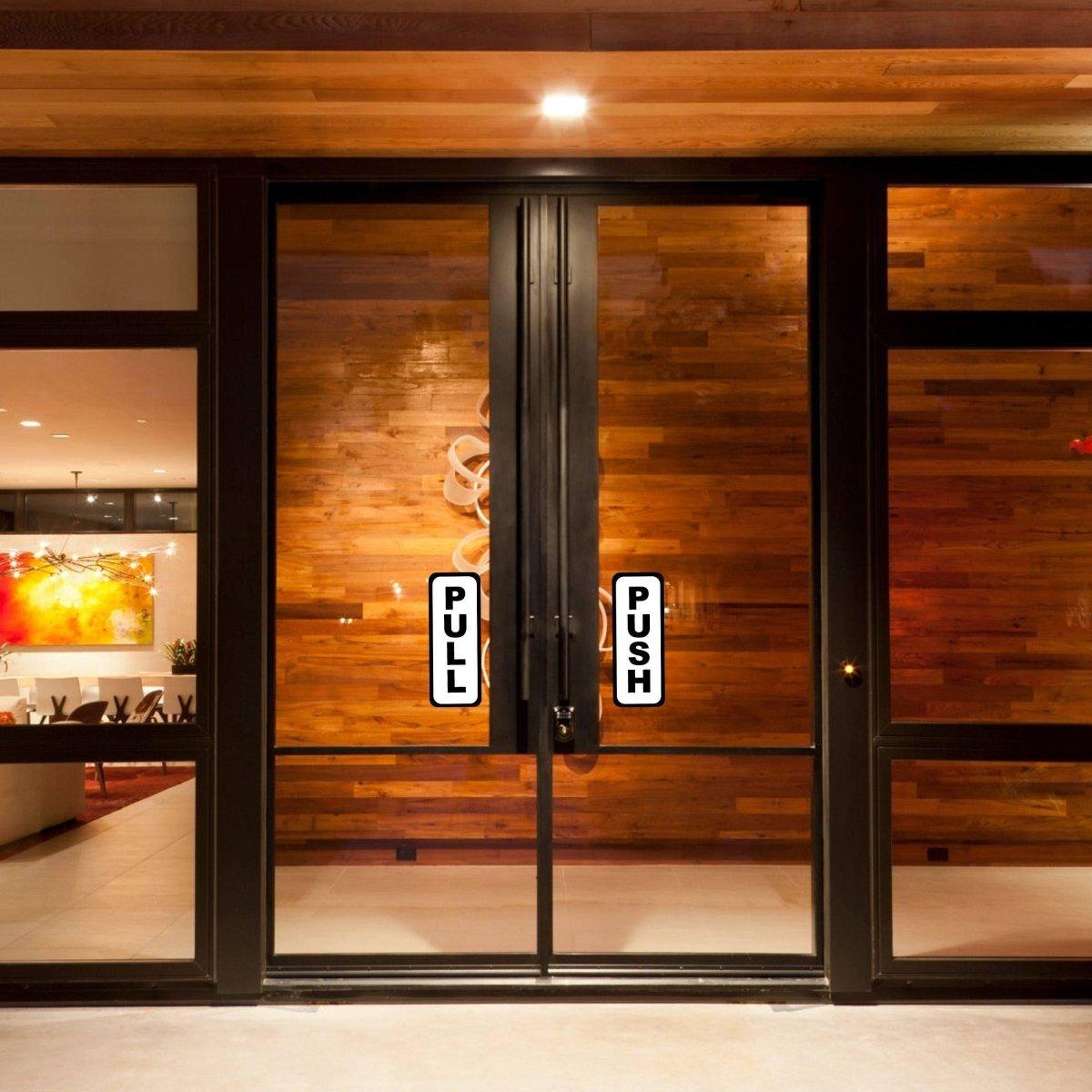 Adhesive doorway signage kit with 'PULL' and 'PUSH' labels on glass doors for directional guidance.