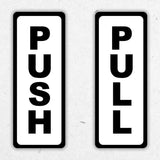 Adhesive doorway signage kit with clear 'PUSH' and 'PULL' labels. Ideal for easy navigation.