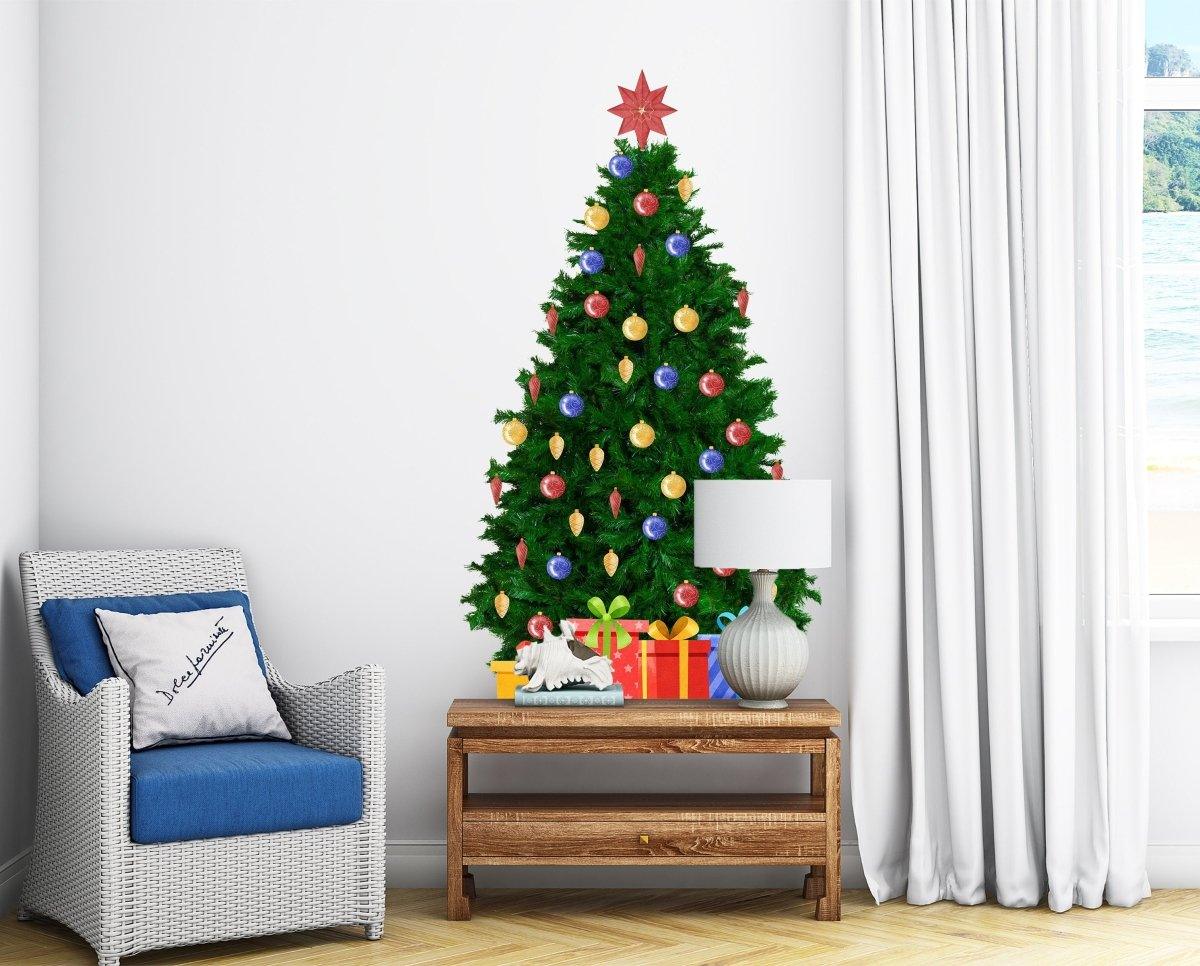 Christmas pine wall decal with colorful ornaments and star, decorating a cozy living room.