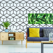 Geometric wall mural decal featuring a hexagon honeycomb design in a stylish living room setting.
